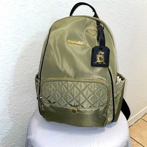 STEVE MADDEN. Olive green, Gold zippers and logo , with black strap on backpack